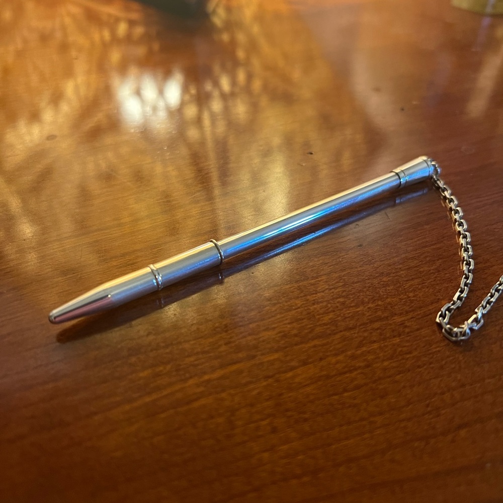 Beautiful and chic Hermes sterling silver agenda / bag pen.